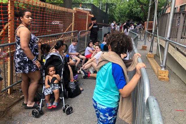 A photo of would-be pool goers waiting in line at McCarren Park Pool
